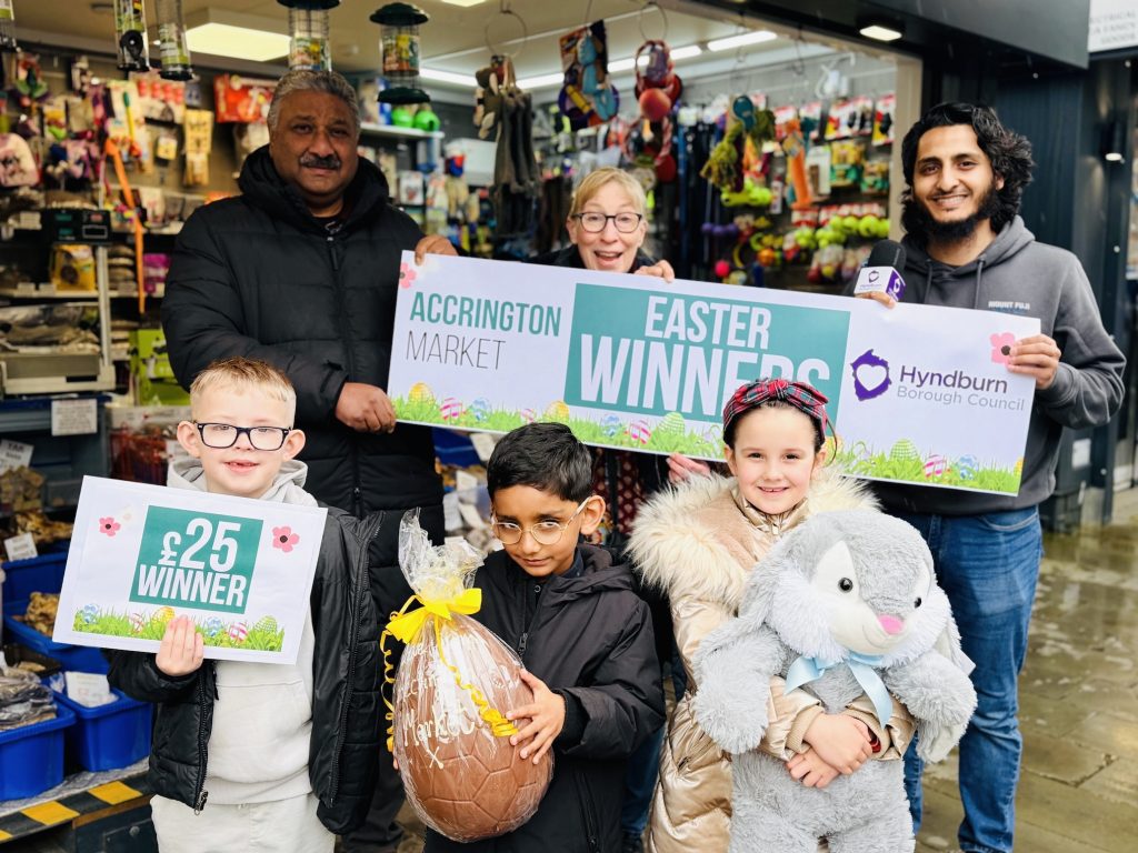 children holding easter banner and easter eggs
