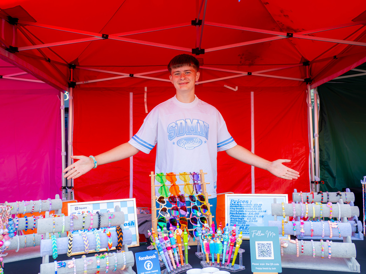 Teenager standing at a market stall